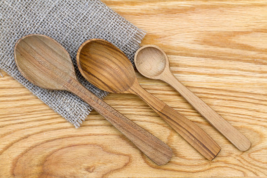 Three tablespoons of wooden spoons on the table.