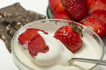 Strawberry in sour cream and cream, slices and whole, with chocolate