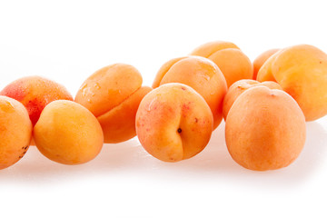 peaches and apricots isolated on white background