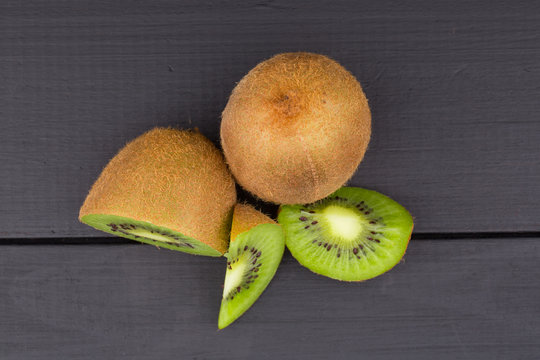 Kiwi fruit on brown wooden background