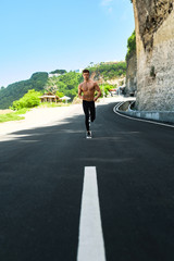 Obraz premium Sport. Topless Handsome Athletic Man With Fit Muscular Body In Sportswear Running On Road. Healthy Active Runner Jogging During Outdoor Workout, Exercising And Training For Marathon. Fitness Concept