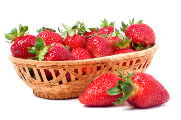 strawberries in a wicker basket isolated on white background