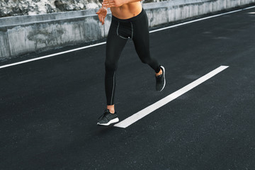 Sport. Close Up Of Sporty Male Legs In Sportwear And Sneakers Running On Road. Healthy Active Athletic Runner Man Jogging During Outdoor Workout, Exercising And Training For Marathon. Fitness Concept