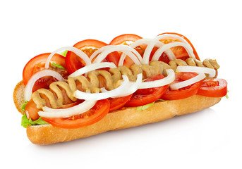 American style hot dog with lettuce, onion and tomato close-up on white background. Fast food.