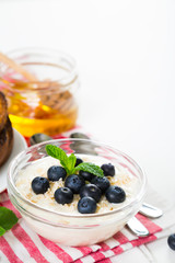 Yogurt with fresh blueberries, honey and toast, healthy breakfast