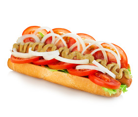 American style hot dog with lettuce, onion and tomato close-up on white background. Fast food.