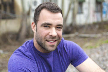 nice young man portrait on the railroad