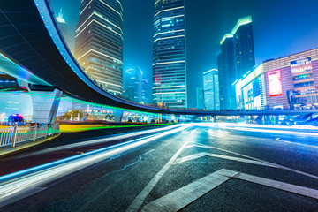 Fototapeta na wymiar light trails through pedestrian bridge ,shanghai