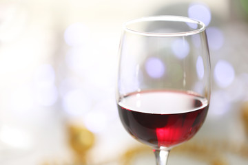 Wineglasses on blurred lights background