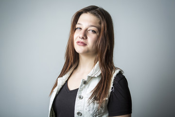 Urban girl in studio posing with attitude