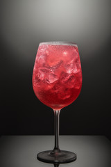 Coctail with ice on black background