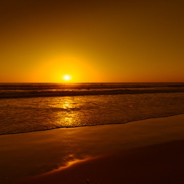 Evening sunset painted waves of ocean surf.  Beach in San Diego, California. Long exposure.