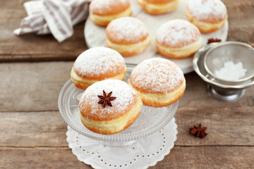 Fresh homemade donuts with powdered sugar, close up
