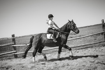 Beautiful teen girl on the farm with her horse.