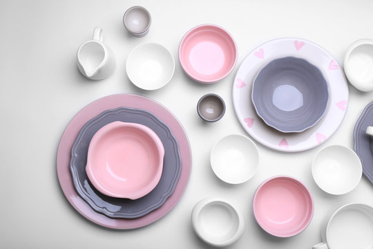 Empty colorful dishes on white background.