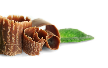 Milk chocolate chips with fresh mint, isolated on white