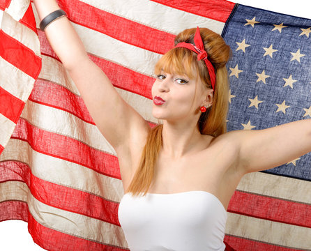 Sexy pin up girl  holding an American flag.