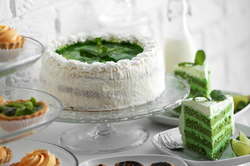 Different delicious desserts on table