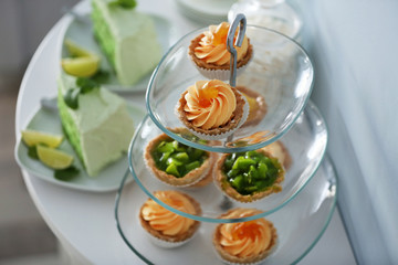 Delicious desserts  on a glass stand