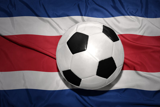 black and white football ball on the national flag of costa rica