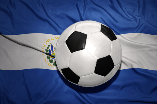 black and white football ball on the national flag of el salvador