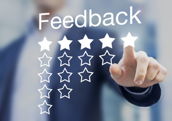 Satisfied customer pushing a five-star feedback rating button
