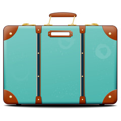 Turquoise suitcase with blank tag on surface