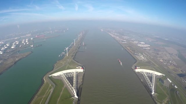 Aerial medium altitude of Maeslantkering Maeslant barrier part of Delta Works Delta Werken Deltaworks Netherlands Holland storm surge barrier Rotterdam and one of largest moving structures on Earth 4k