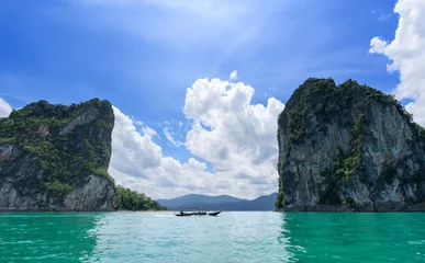 Deurstickers Boat traveling pass canyon mountains on a great lake in Thailand © Urbanscape