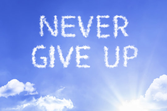 Never Give Up cloud word with a blue sky