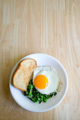 Local kale and a beautiful sunny side egg for a quick and easy weekday breakfast.