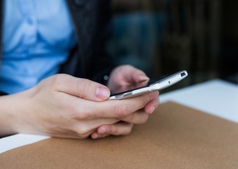 woman holding her smartphone