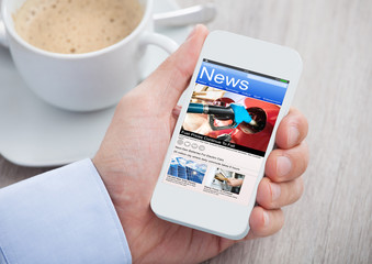 Person Reading News On Phone