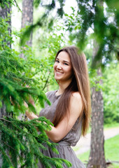 young, beautiful, sexy woman in park on walk