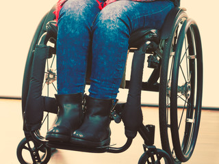 Disabled young girl on wheelchair.