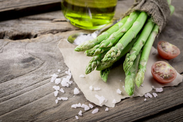 Fresh green asparagus with tomatoes and sea salt