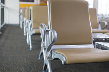 brown leather chair in airport terminal