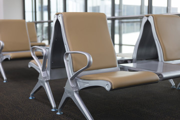 brown leather chair in airport terminal