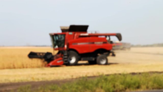 combine-harvester removes from the field harvest  /  combine-harvester removes from the field harvest , blurred background