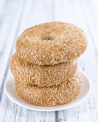 Fresh Bagels with Sesame (close-up shot; selective focus)