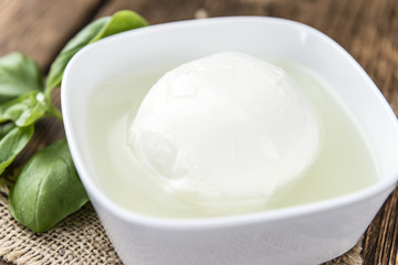Portion of fresh Mozzarella (close-up shot)