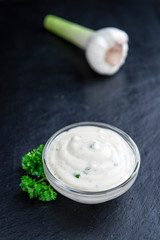 Portion of Garlic Sauce on a slate slab