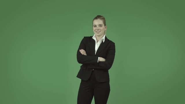 attractive caucasian business girl isolated on green confident