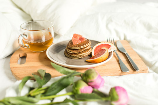 Breakfast In Bed, Oatmeal Pancakes With Grapefruit, Tea And Peon