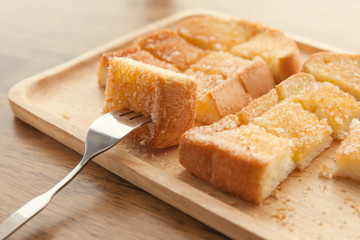 Toast bread on wooden background closeup