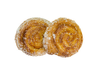 Cinnamon rolls with coconut on white background
