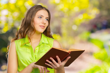 Fototapeta premium Woman with a book on her hands