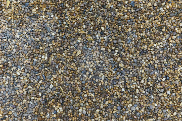 Many color round stone on the ground.