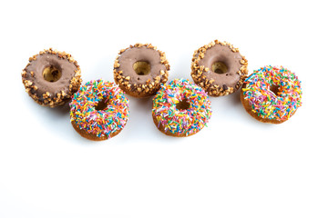 various donuts on white background