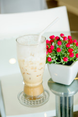 Ice coffee on the table glass.